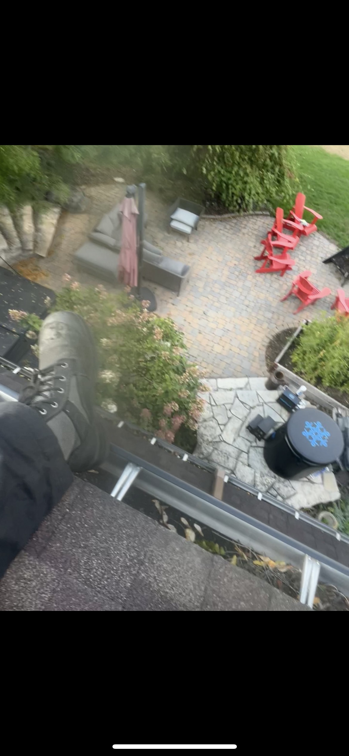View looking down from roof during gutter cleaning