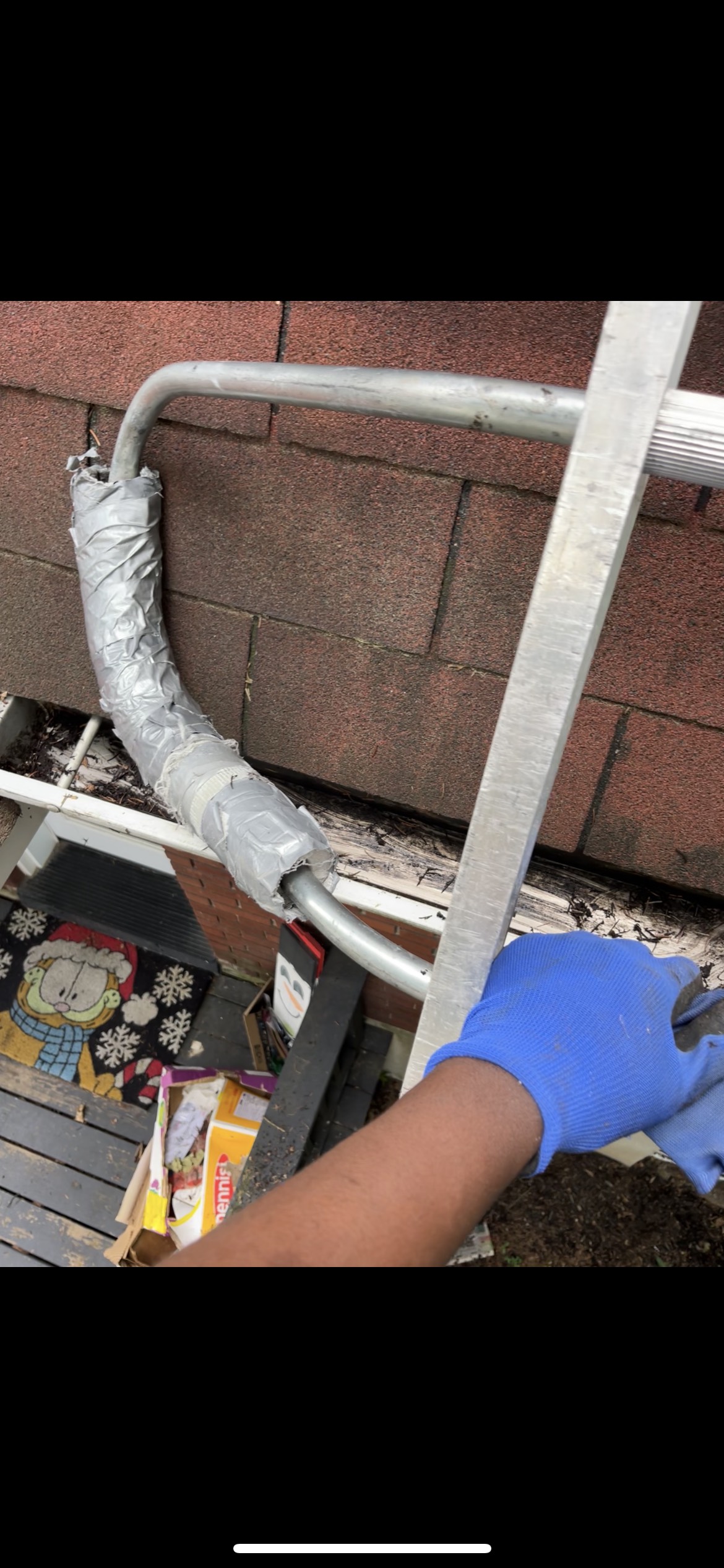 Reaching high fascia board with extension cleaning pole