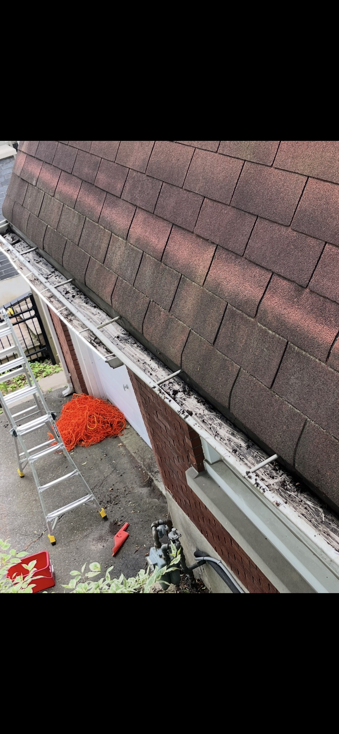 Clean eavestrough line after debris removal
