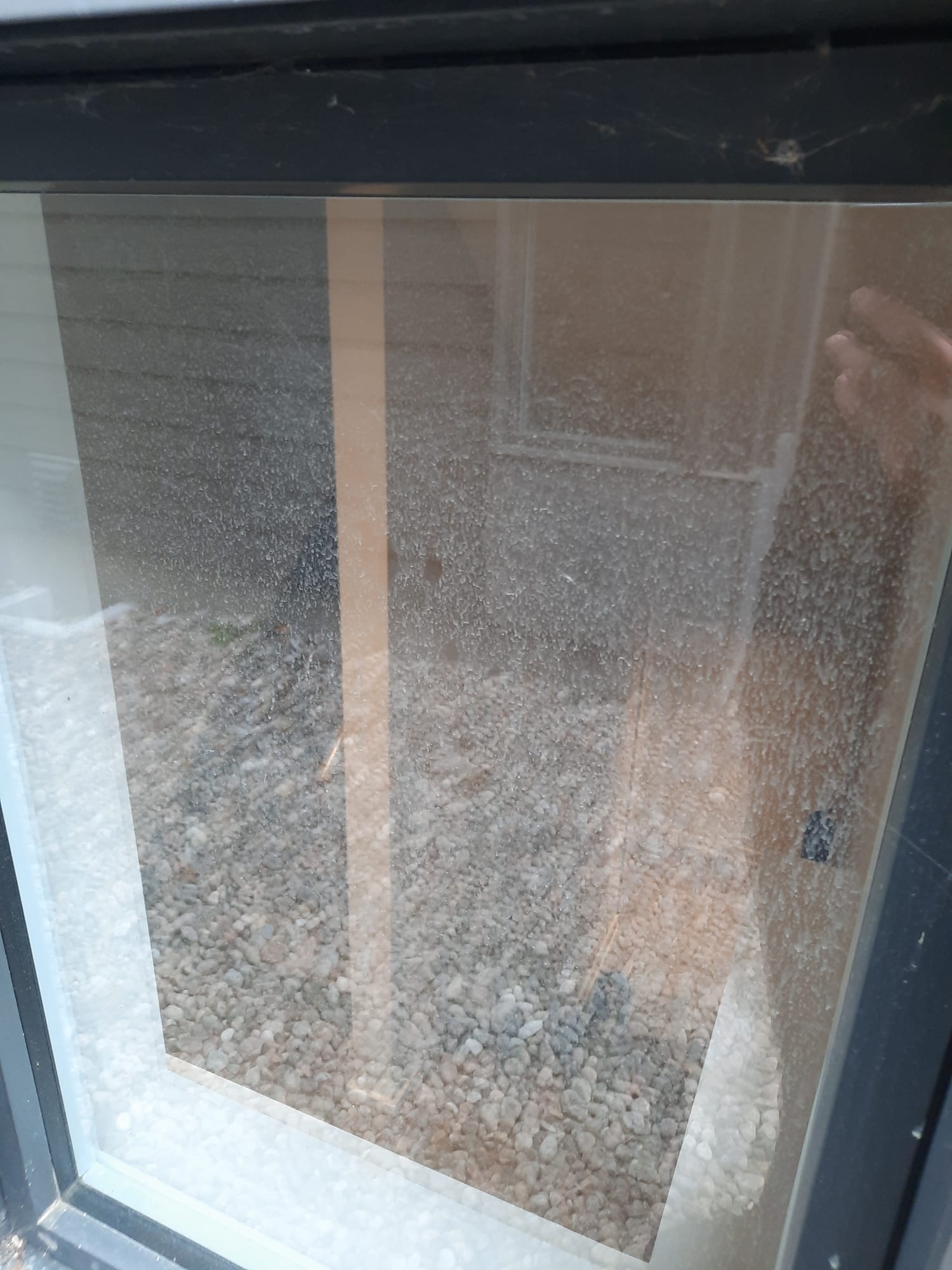 Dirty window before HomeShowers cleaning